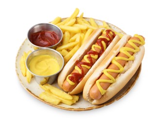 Photo of Tasty hot dogs with fries and sauces isolated on white