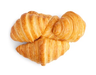 Photo of Tasty fresh croissants isolated on white, top view. Puff pastry