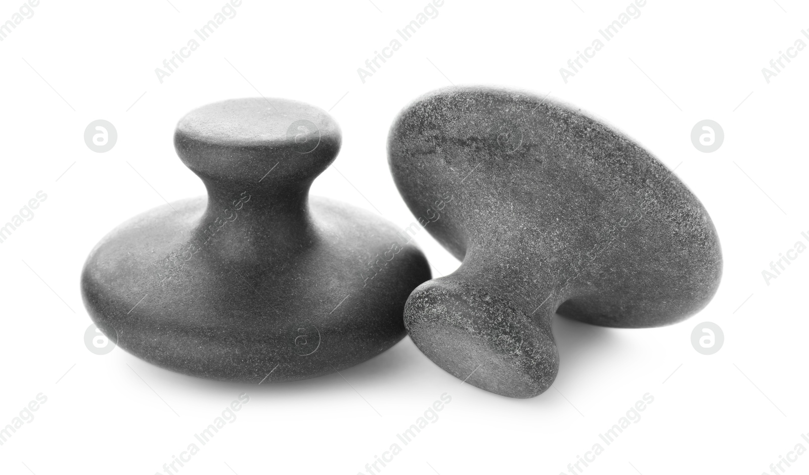 Photo of Massage stones isolated on white. Spa treatment