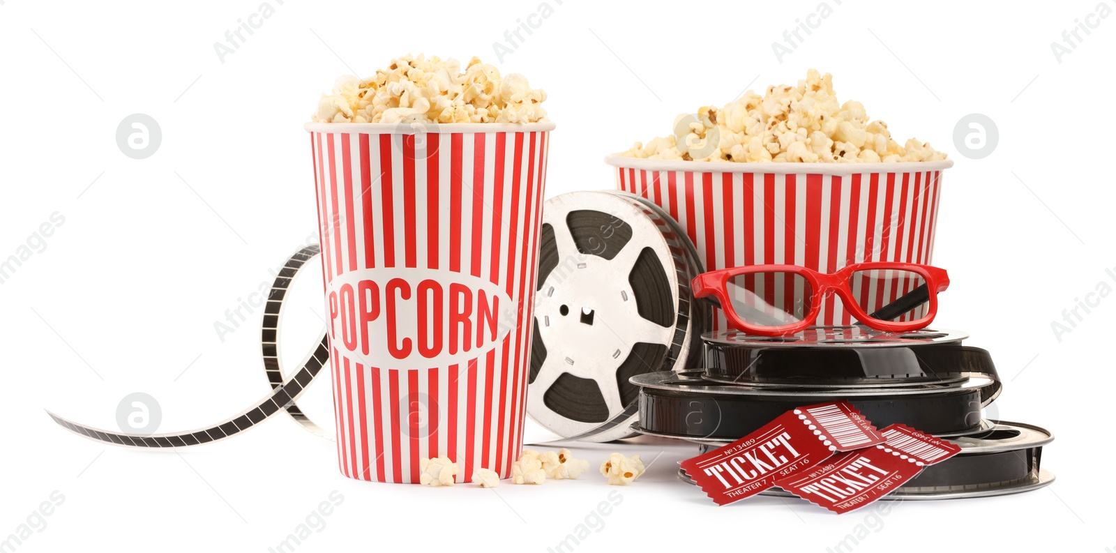 Photo of Tasty popcorn, film reels, glasses and movie tickets isolated on white