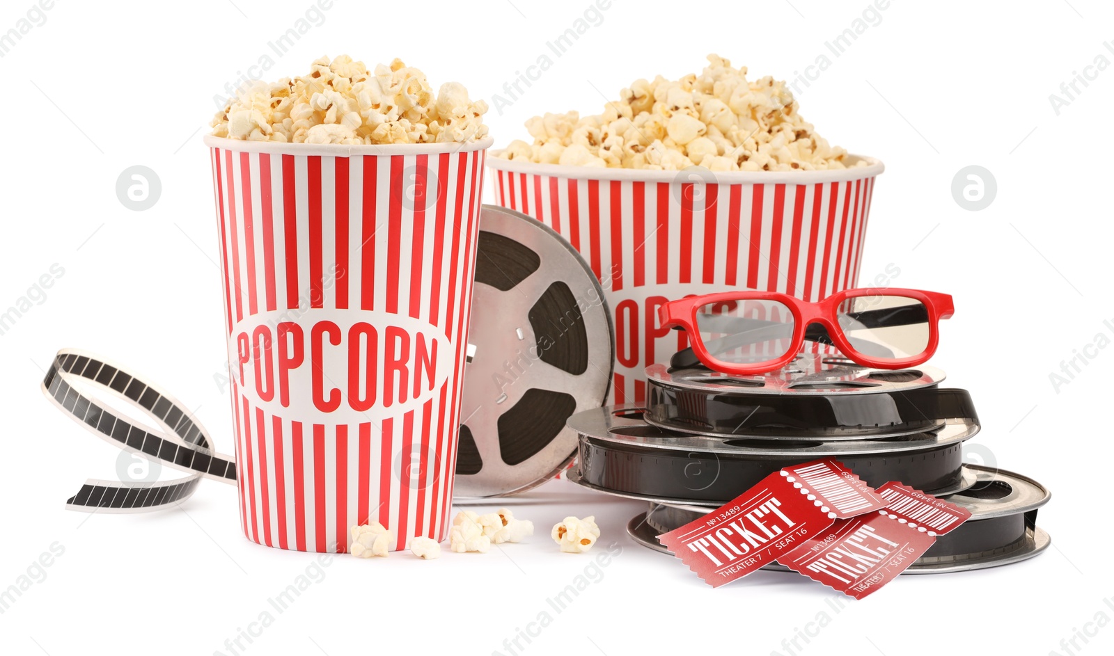 Photo of Tasty popcorn, film reels, glasses and movie tickets isolated on white