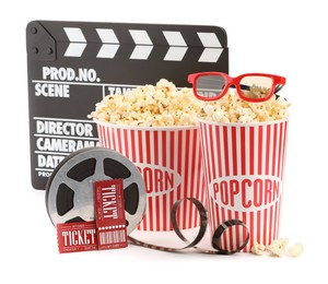 Photo of Tasty popcorn, film reel, clapper, glasses and movie tickets isolated on white