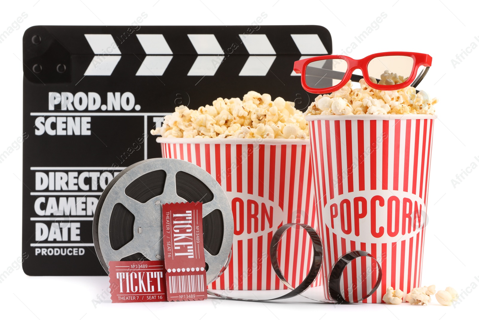 Photo of Tasty popcorn, film reel, clapper, glasses and movie tickets isolated on white