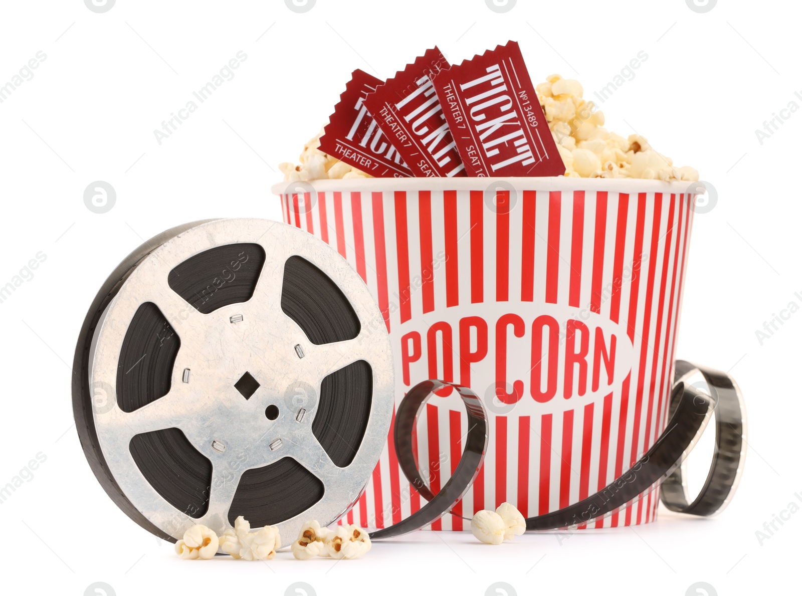 Photo of Tasty popcorn, film reel and movie tickets isolated on white