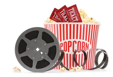 Photo of Tasty popcorn, film reel and movie tickets isolated on white