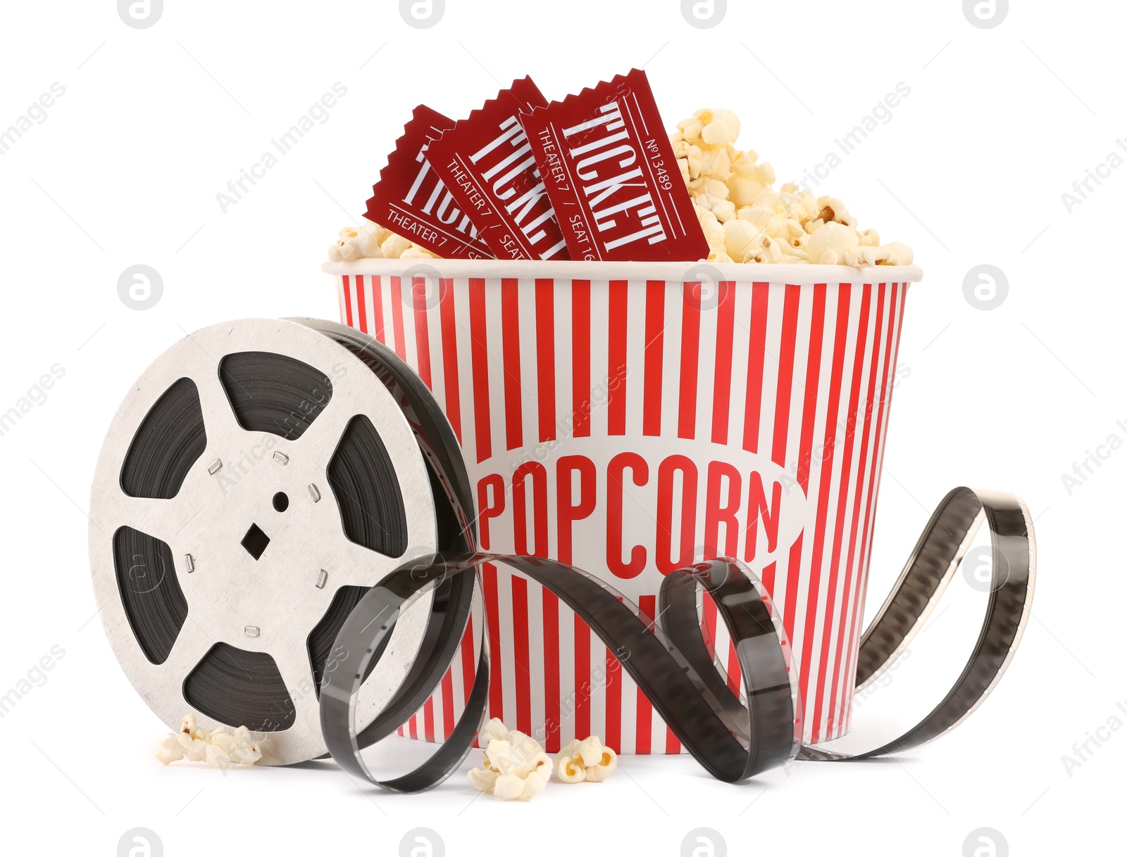 Photo of Tasty popcorn, film reel and movie tickets isolated on white