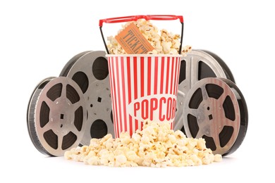 Photo of Tasty popcorn, film reels, glasses and movie ticket isolated on white