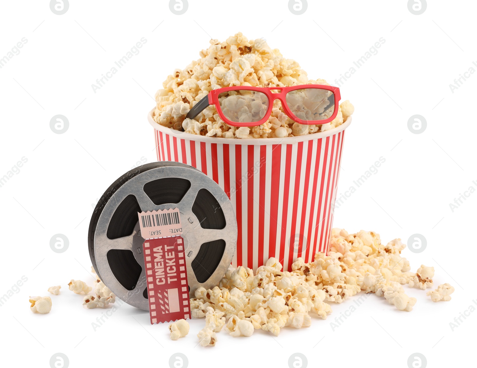 Photo of Tasty popcorn, film reel, glasses and movie ticket isolated on white