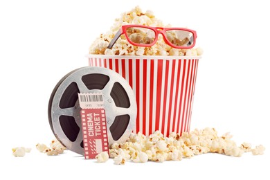 Photo of Tasty popcorn, film reel, glasses and movie ticket isolated on white