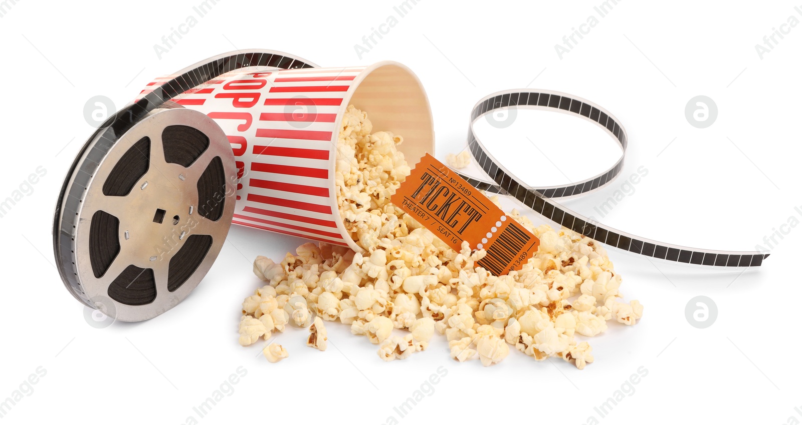 Photo of Tasty popcorn, film reel and movie ticket isolated on white