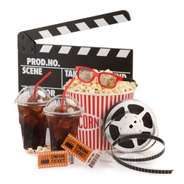 Photo of Tasty popcorn, film reel, glasses, clapper, soda drinks and movie tickets isolated on white