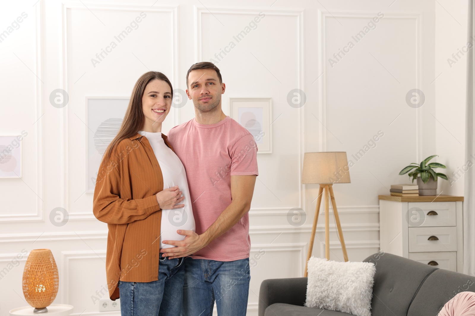 Photo of Pregnant woman and her husband at home