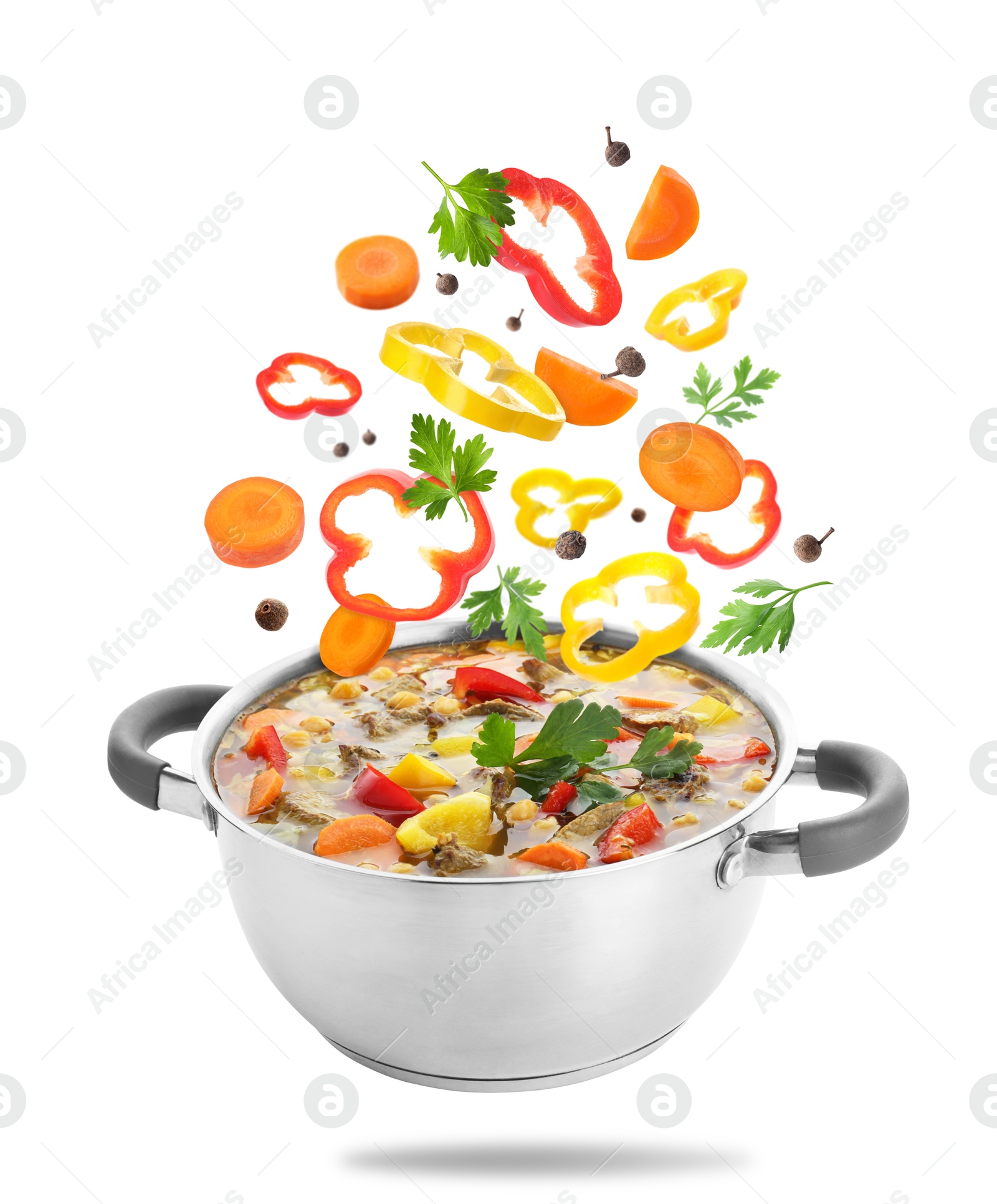 Image of Vegetables for soup and pot in air on white background