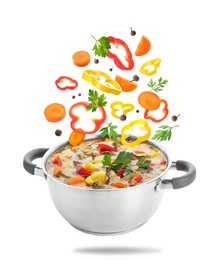 Image of Vegetables for soup and pot in air on white background