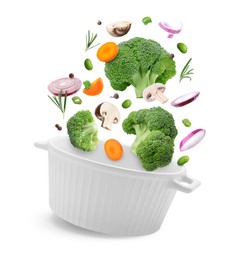 Image of Vegetables for soup and pot in air on white background