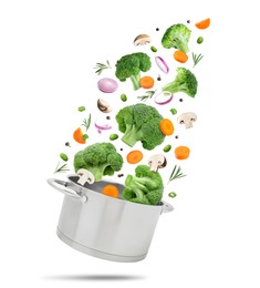 Image of Vegetables for soup and pot in air on white background