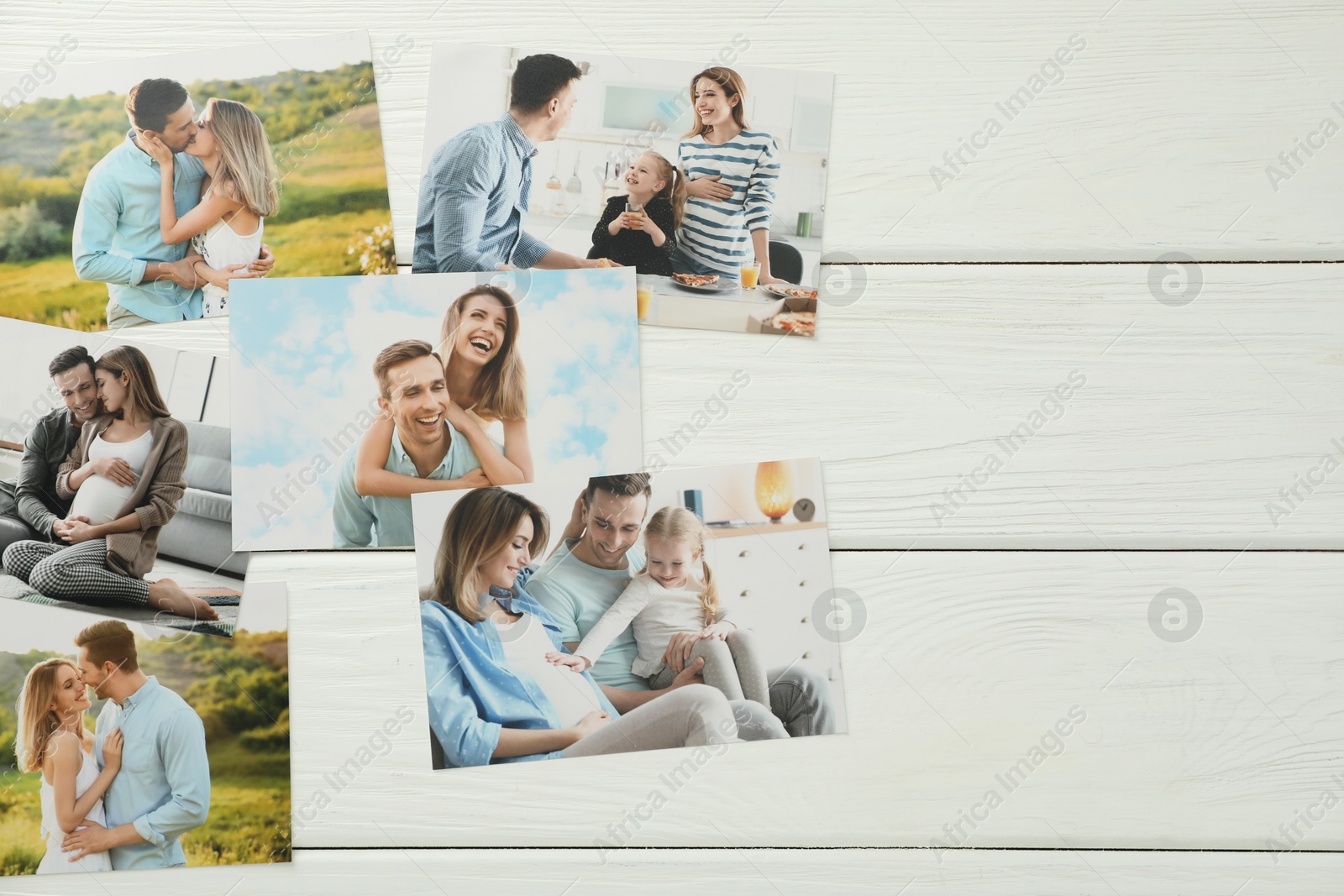 Photo of Different family photos on white wooden table, flat lay. Space for text