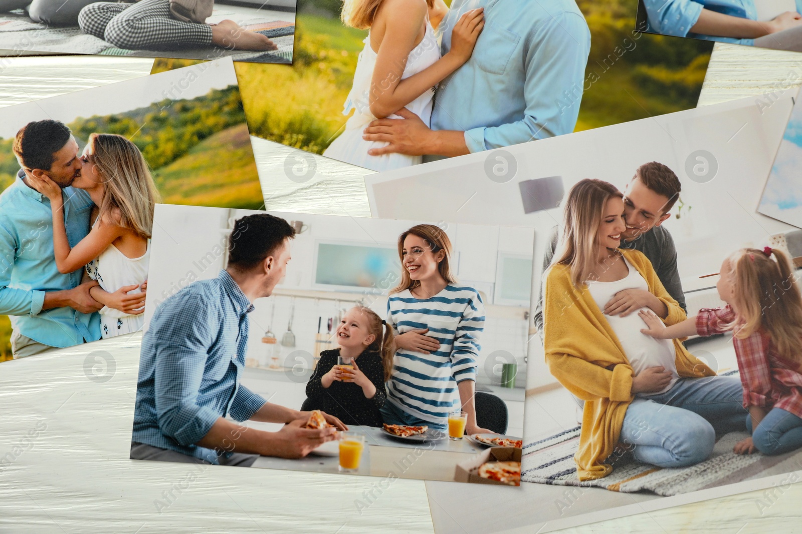 Photo of Different family photos on white wooden table, flat lay