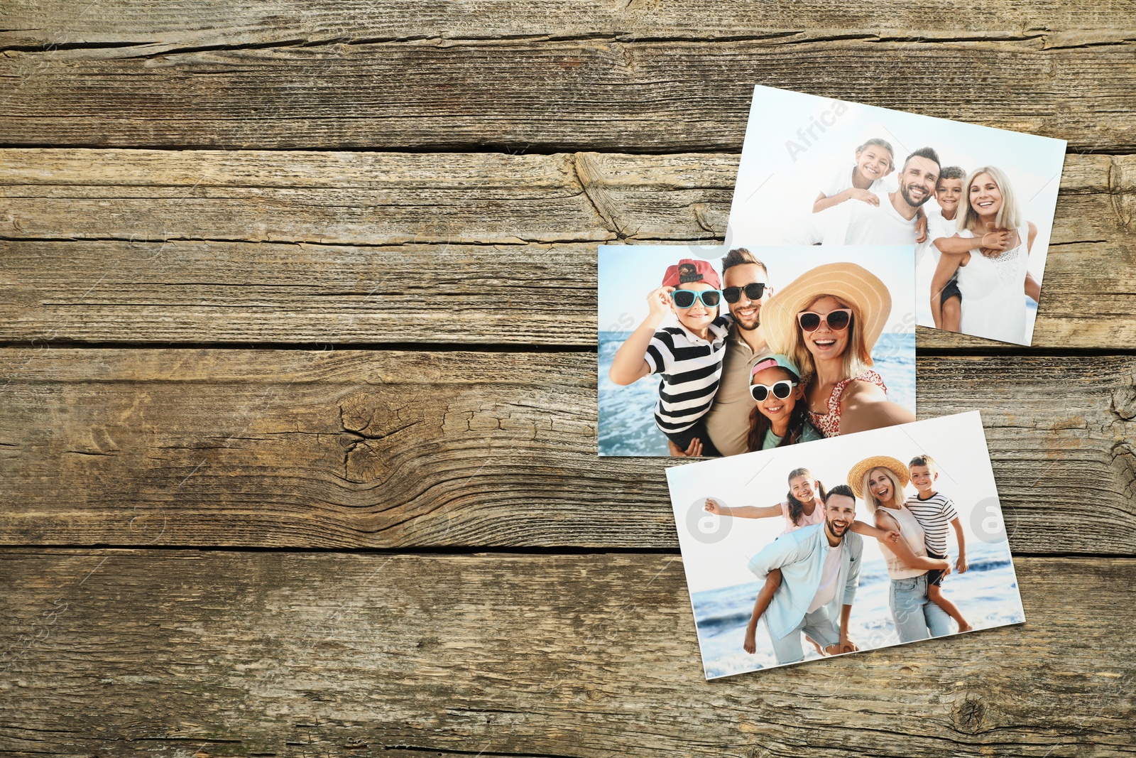 Photo of Different family photos on wooden table, flat lay. Space for text