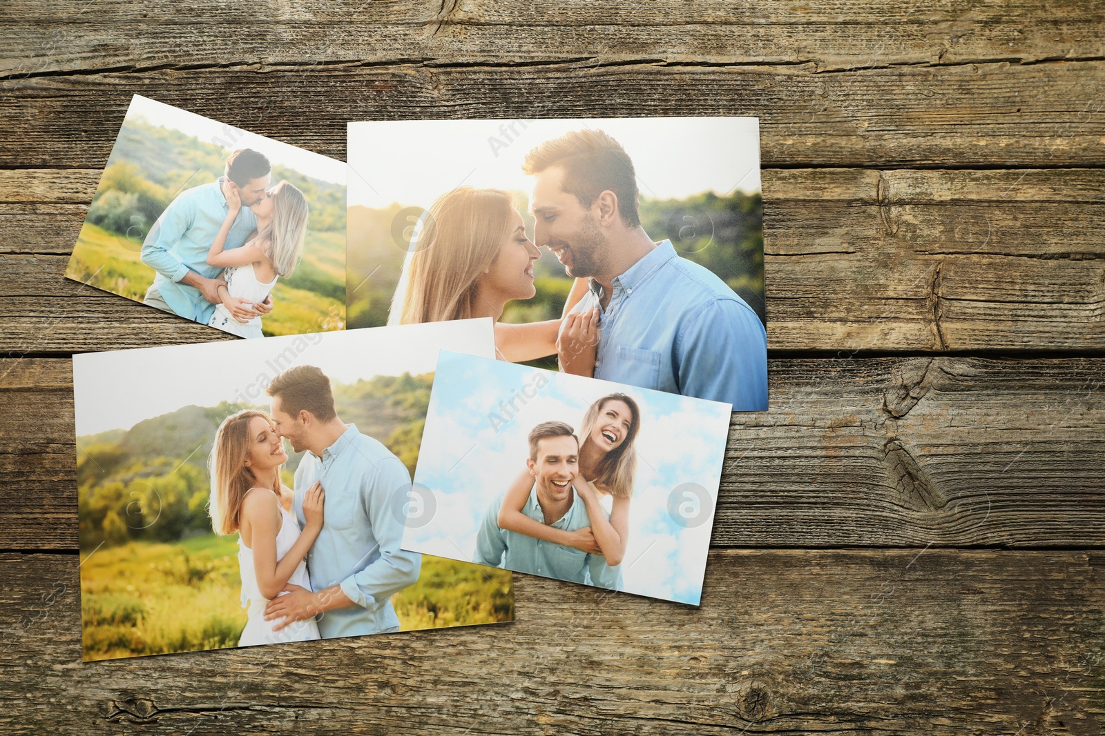 Photo of Different family photos on wooden table, flat lay. Space for text