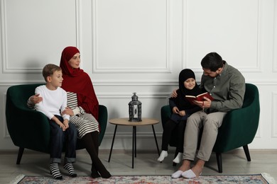 Photo of Happy Muslim family spending time together at home