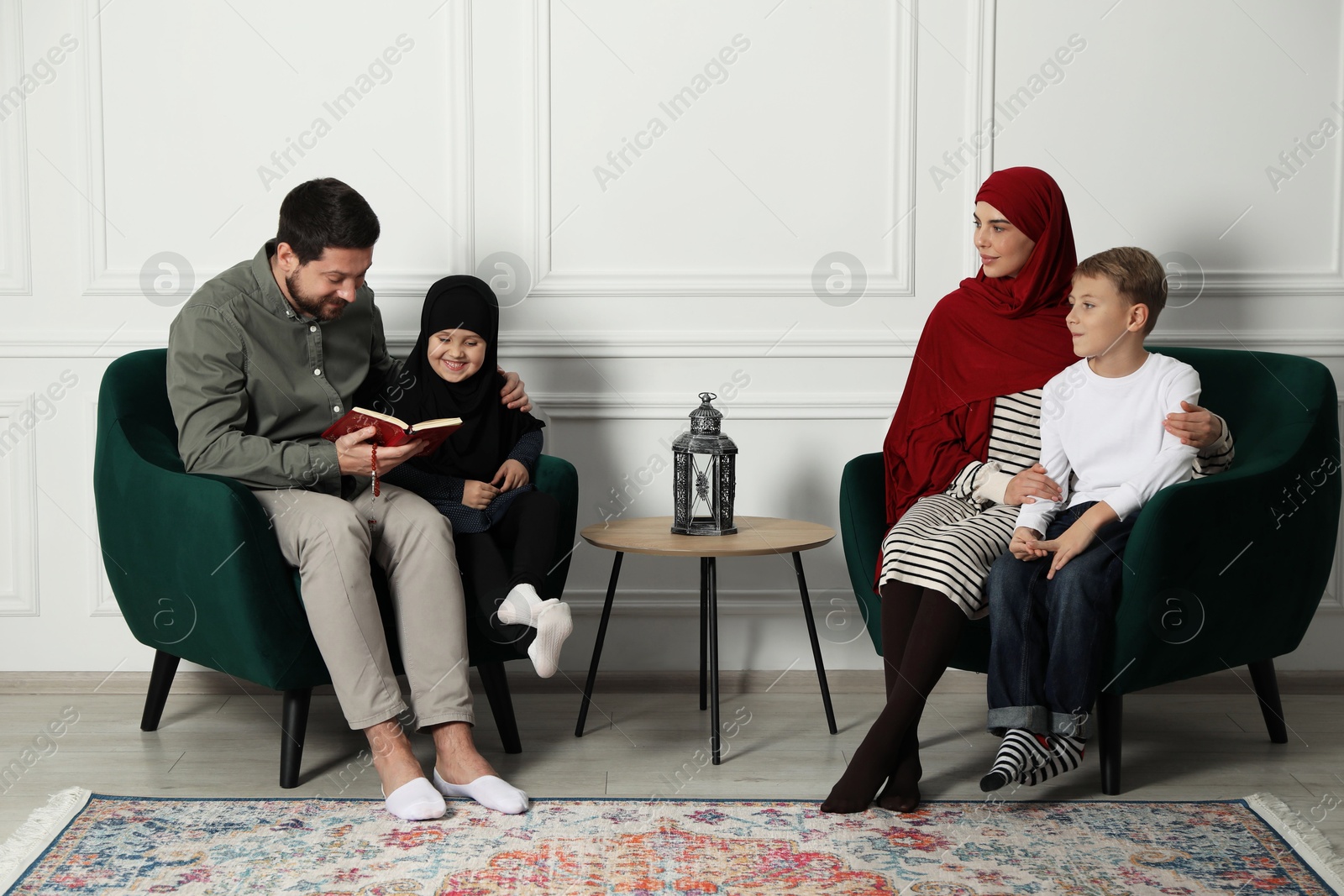 Photo of Happy Muslim family spending time together at home