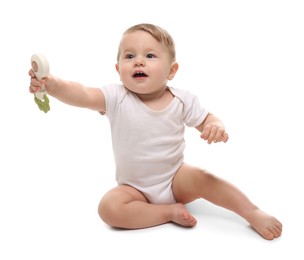 Photo of Cute little baby with toy on white background