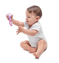 Photo of Cute little baby with toy on white background