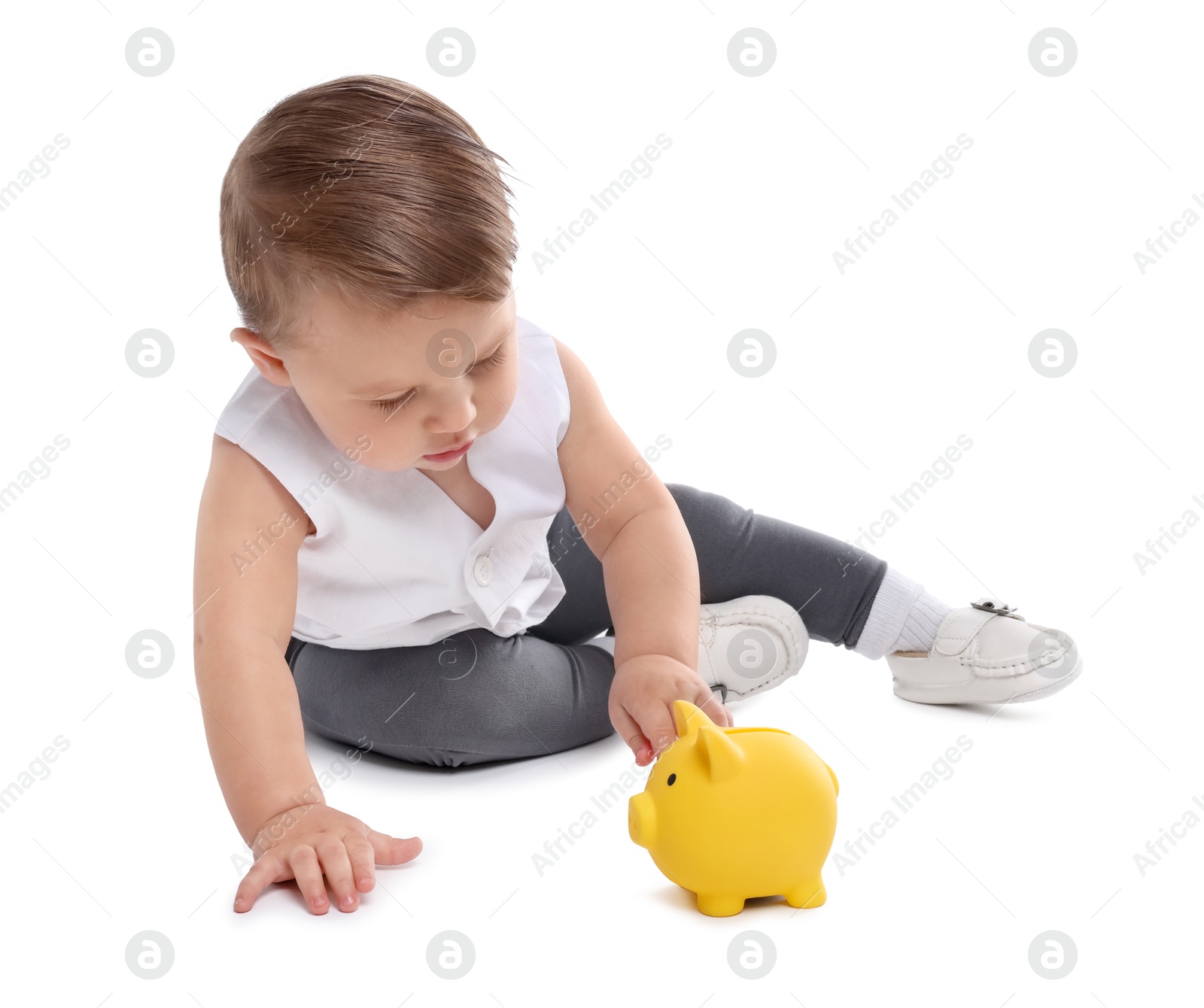 Photo of Little baby with piggybank on white background