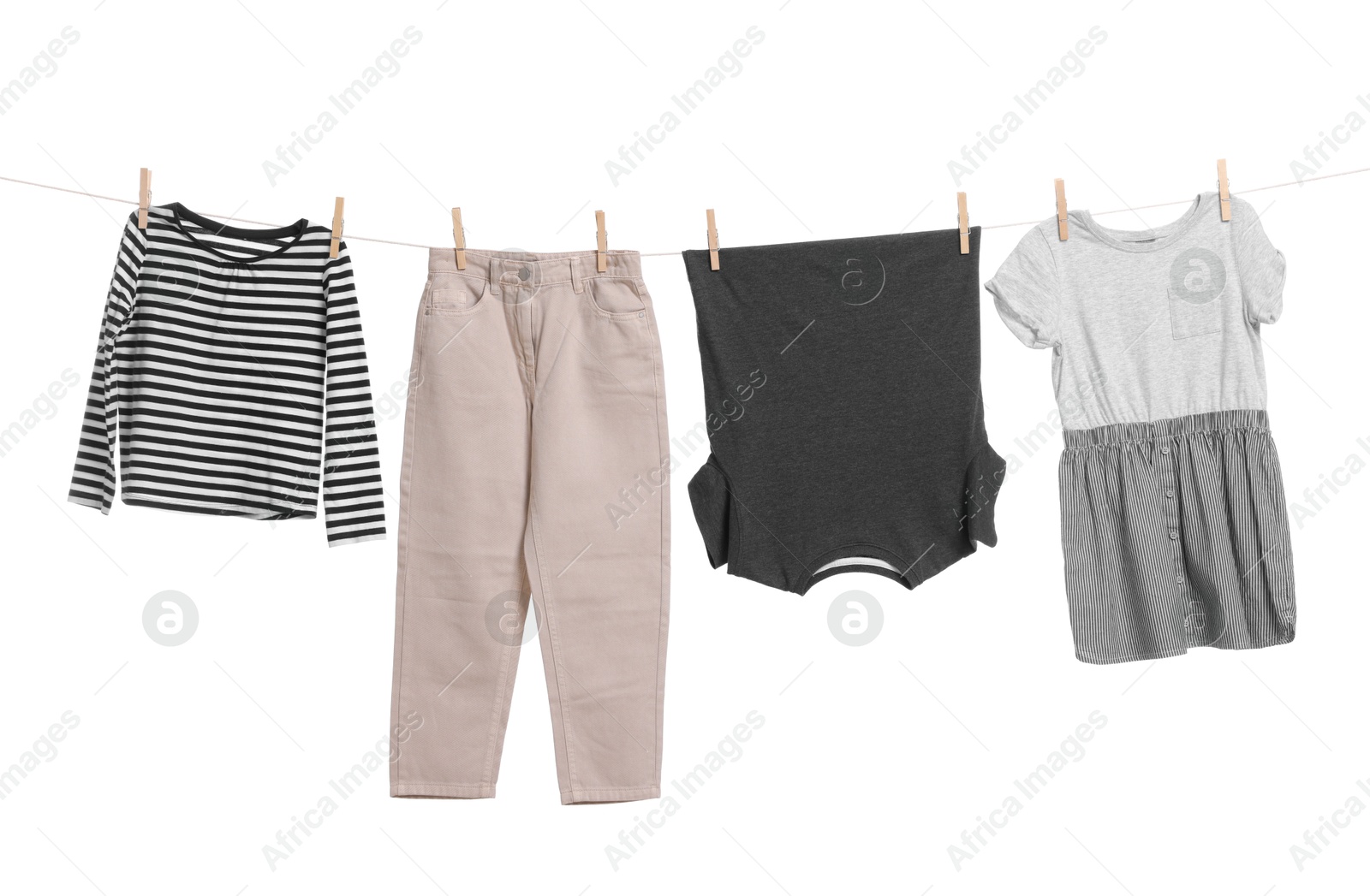 Photo of Different clothes drying on laundry line against white background