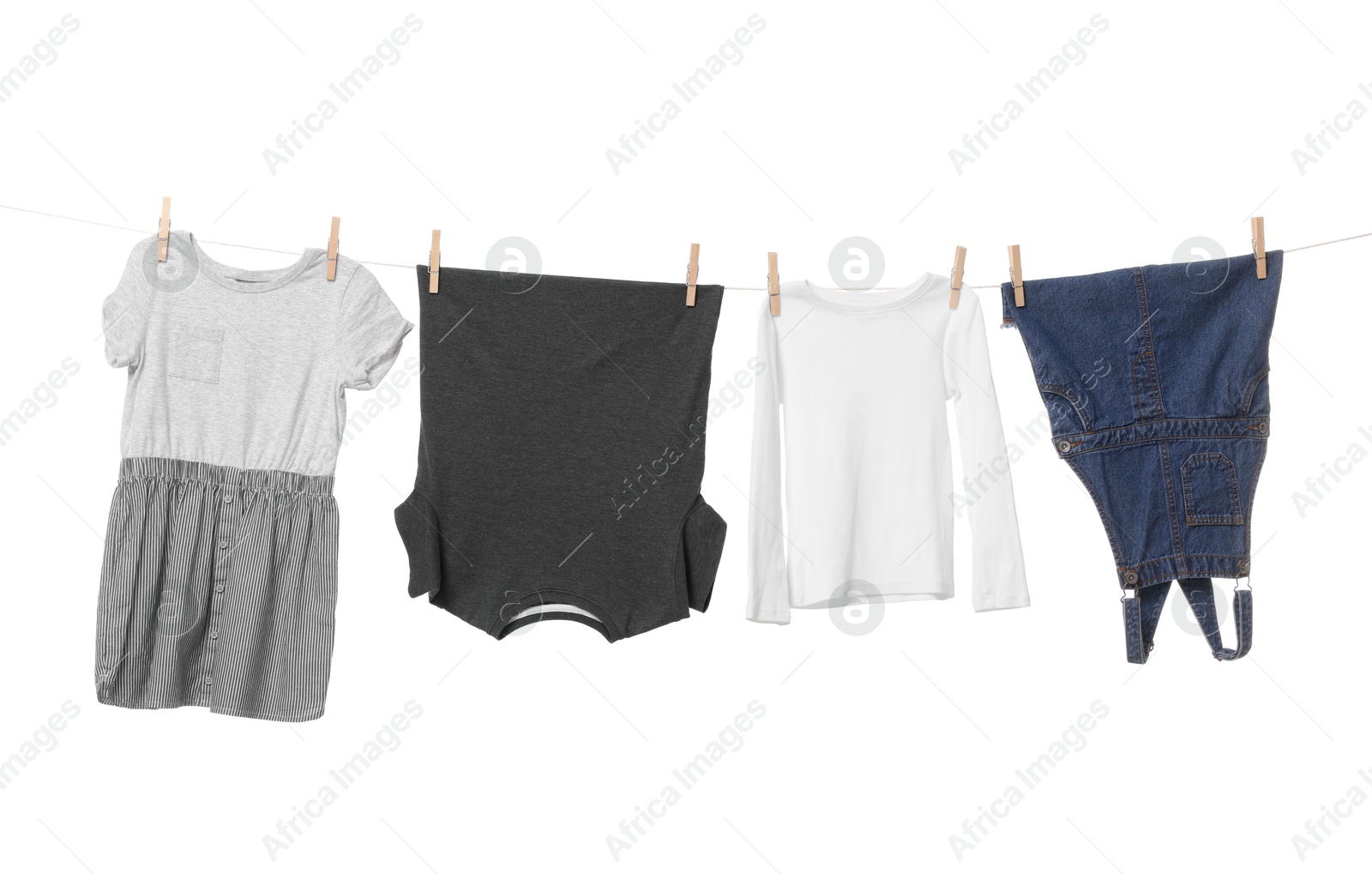 Photo of Different clothes drying on laundry line against white background