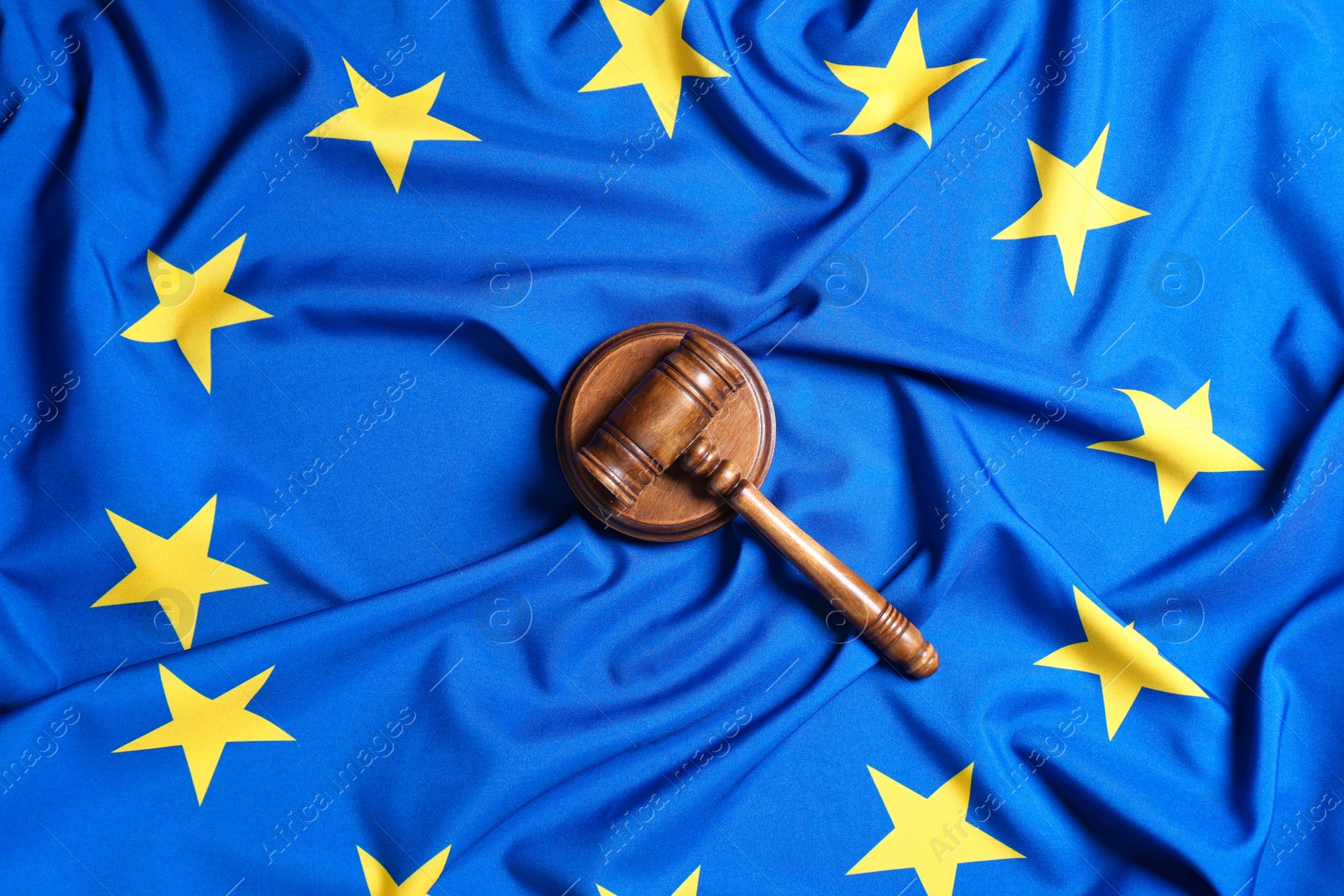 Photo of Judge's gavel on flag of European Union, top view