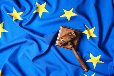 Photo of Judge's gavel on flag of European Union, top view. Space for text