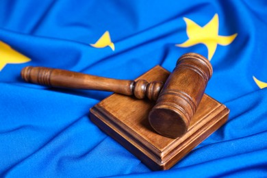 Photo of Judge's gavel on flag of European Union, closeup