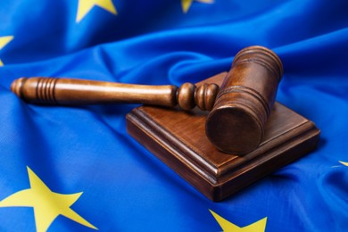 Photo of Judge's gavel on flag of European Union, closeup