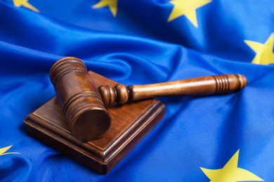 Photo of Judge's gavel on flag of European Union, closeup