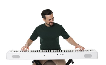 Photo of Bearded man playing synthesizer on white background