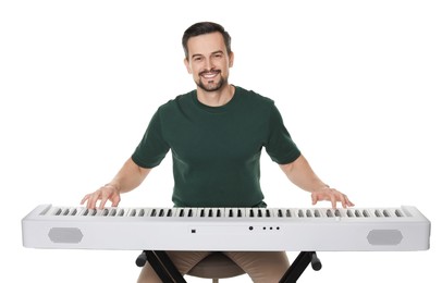 Photo of Smiling man playing synthesizer on white background