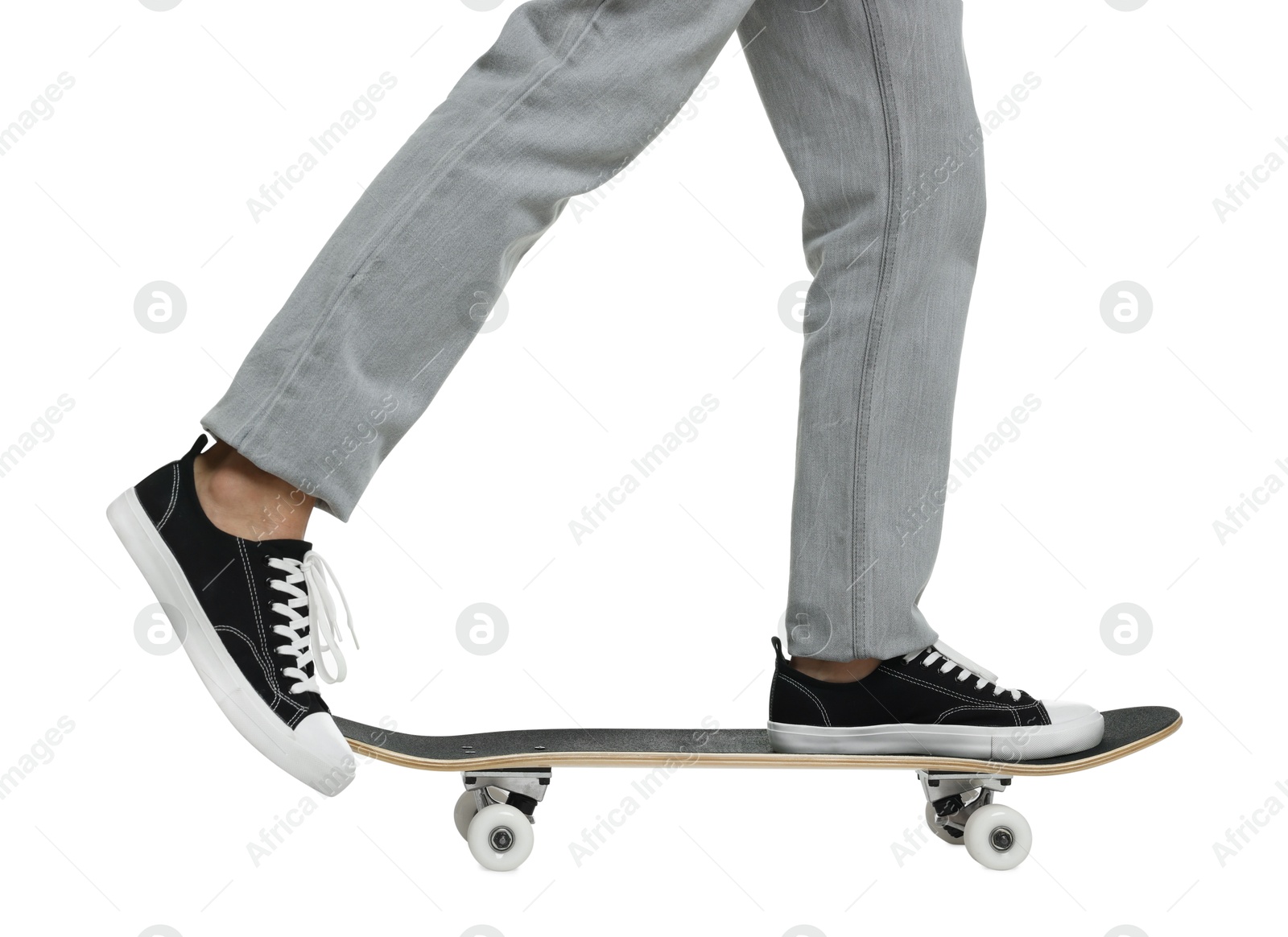 Photo of Man riding skateboard on white background, closeup