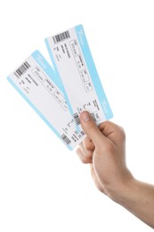 Photo of Travel agency. Man holding flight tickets on white background, closeup