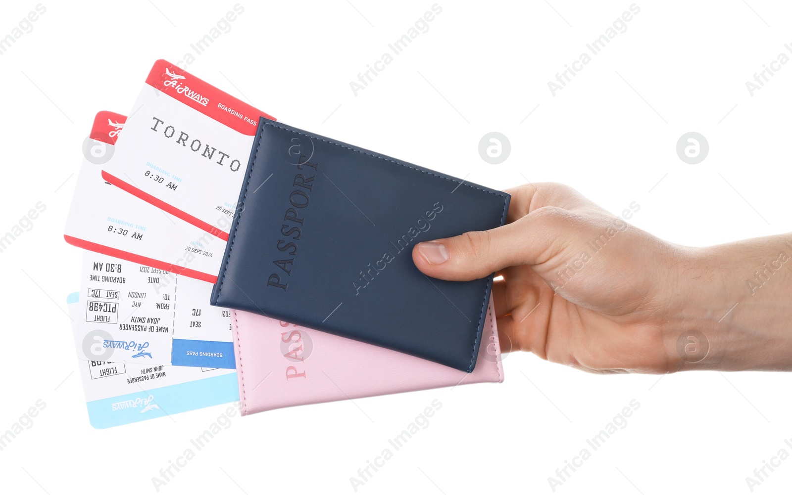 Photo of Travel agency. Man holding passports with flight tickets on white background, closeup