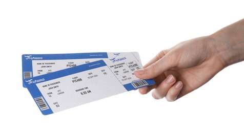 Photo of Travel agency. Woman holding flight tickets on white background, closeup