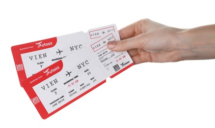 Photo of Travel agency. Woman holding flight tickets on white background, closeup