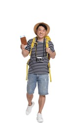 Photo of Happy traveller with passport and ticket on white background