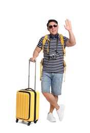 Photo of Happy traveller with suitcase on white background