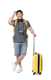 Photo of Happy traveller with suitcase on white background