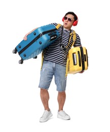 Photo of Traveller carrying heavy suitcases on white background