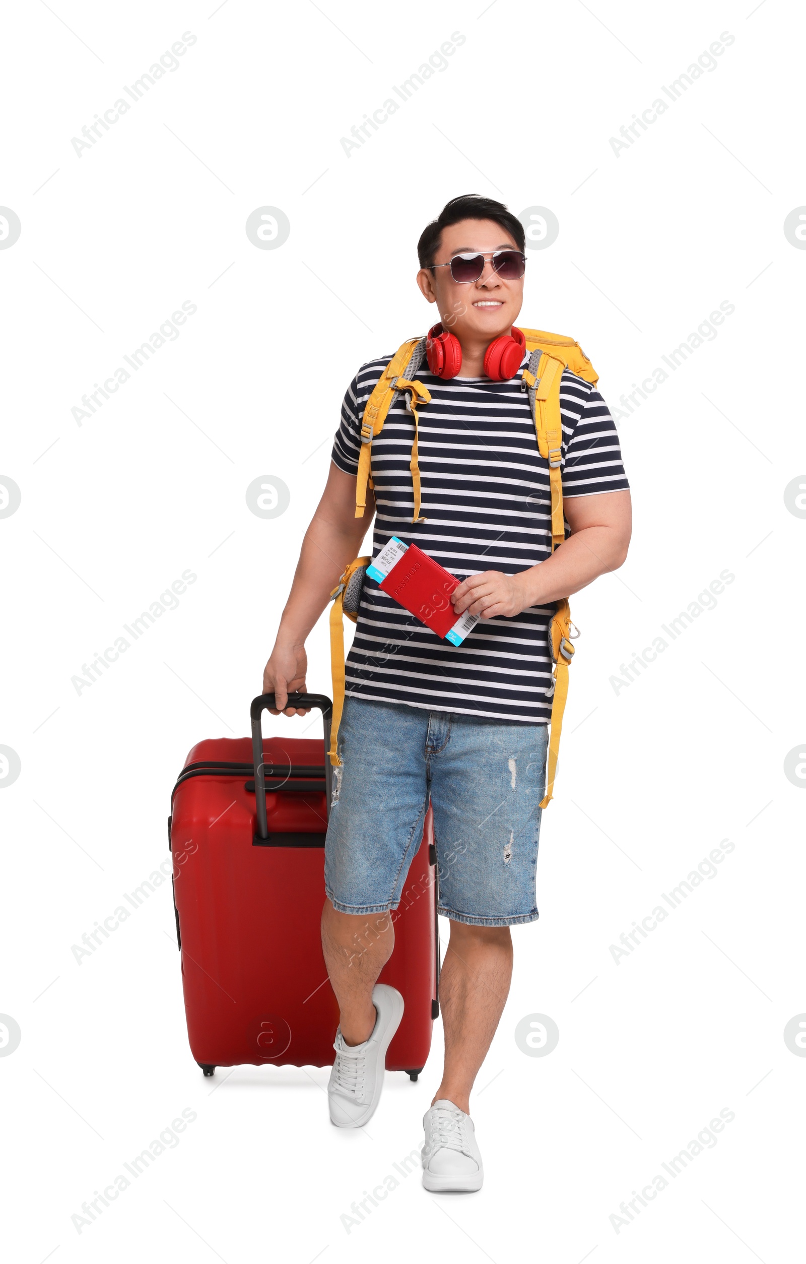 Photo of Traveller with suitcase and passport on white background