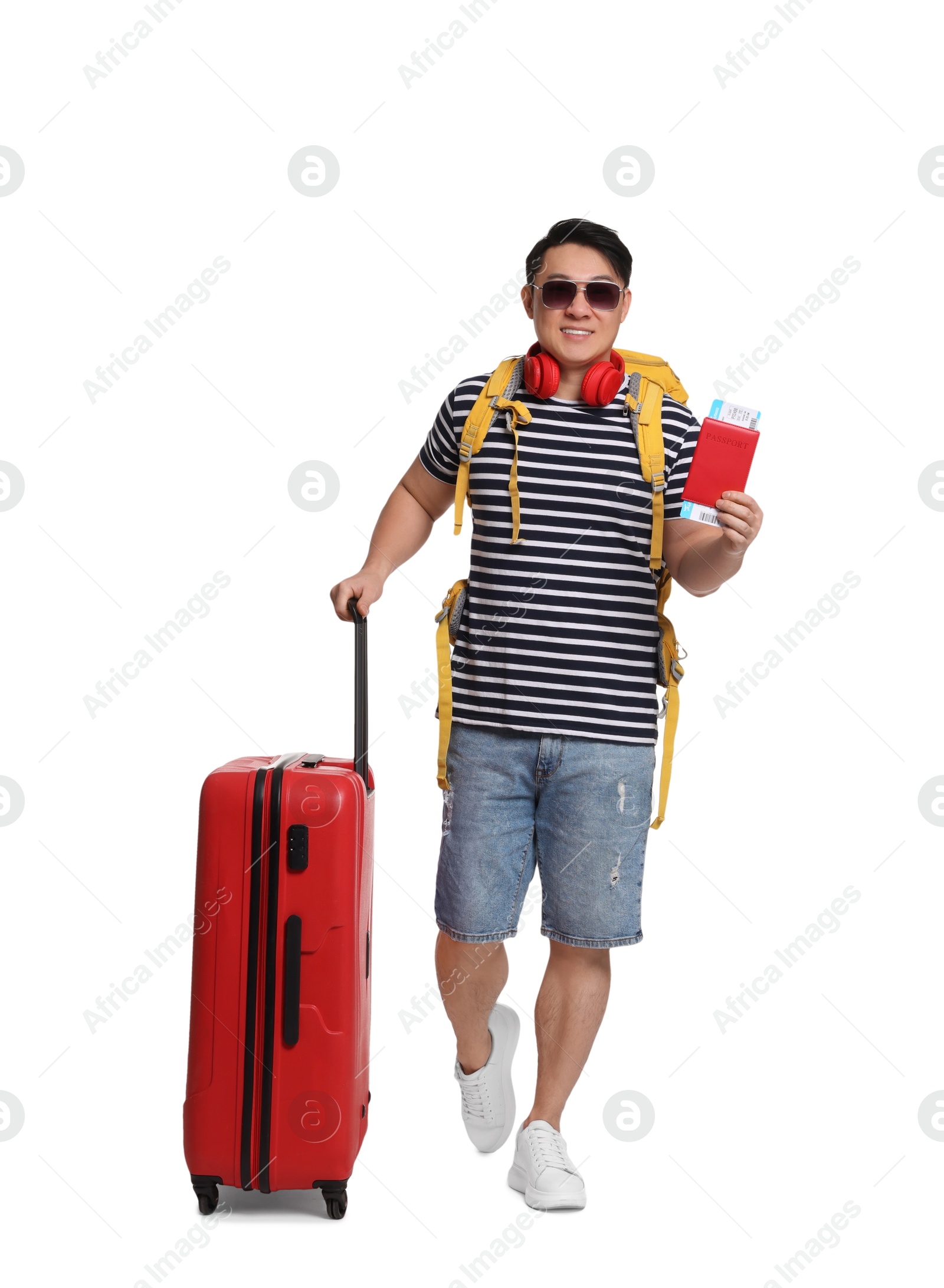 Photo of Traveller with suitcase and passport on white background