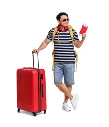 Photo of Traveller with suitcase and passport on white background